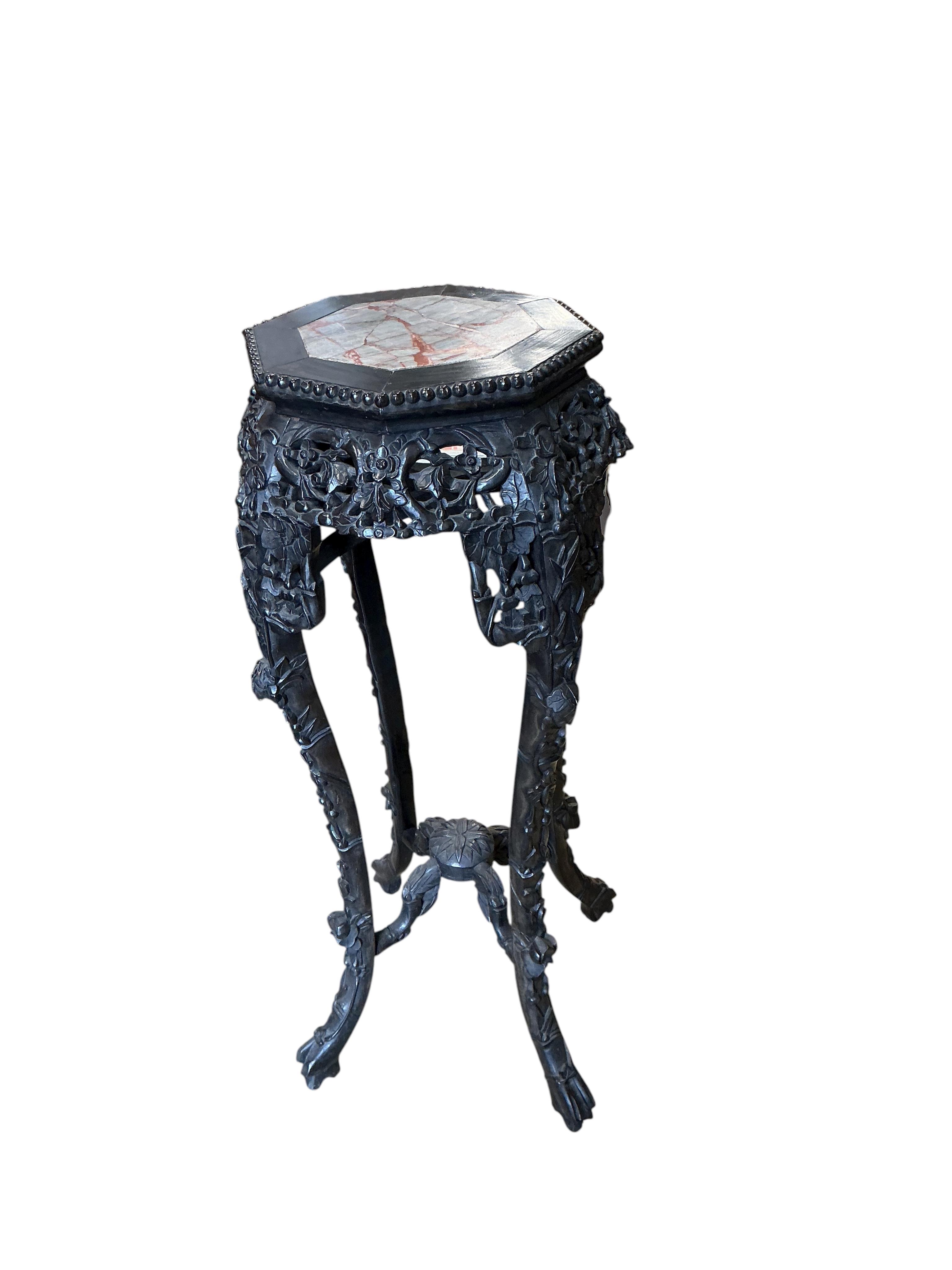 A Chinese marble topped octagonal vase stand, width 38cm, height 90cm